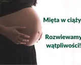 Brzuch kobiety w ciąży, z dłońmi delikatnie go obejmującymi. Obok tekst: "Mięta w ciąży? Rozwiewamy wątpliwości!".